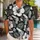 Black Hibiscus and Pistol Aloha Style for Island Escapes and Outdoor Weekend Wear Hawaiian Shirt - 1