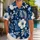 Navy Tropical Foliage Couple Set for Beach Vacations and Honeymoon Island Getaways Hawaiian Shirt - 1