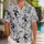 Grinning Skeleton and Spiderweb Motifs for Spooky Halloween Island Getaways and Vacations Hawaiian Shirt - 1