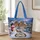 Snowman and Snowy Christmas Village for Cozy Winter Holiday Giving Quilted Tote Bag - 1