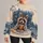 Raccoon Sipping Cocoa in a Snowy Forest for Cozy Winter Days and Relaxed Weekends All-over Print Knitted Sweater - 1
