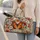 Burnt Orange Butterflies and Wildflowers for Relaxed Summer Beach Getaways Quilted Weekend Bag - 2