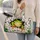 Cheerful Green Frog Breaking Through Cracks for Summer Travel and Adventure Lovers Quilted Weekend Bag - 2