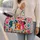 Colorful Dog Faces and Paw Prints for Bright Spring Adventures with Your Favorite Pet Quilted Weekend Bag - 2