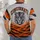 A forward-facing tiger head arched Cincinnati lettering and bold orange-and-charcoal tiger stripes. All-over Print Unisex T-shirt - 4