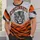 A forward-facing tiger head arched Cincinnati lettering and bold orange-and-charcoal tiger stripes. All-over Print Unisex T-shirt - 6