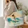 Female Surfer Riding Teal Ocean Waves for Sunny Beach Getaways and Coastal Style Lovers Quilted Tote Bag - 3