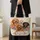 Four distinct dog portraits with scattered colorful garden blooms. Four Beloved Dog Portraits Quilted Tote Bag - 4