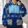 Retro mechanical-character costume surface with a blue body Cyan Chest Screen Yellow Bars and gray segmented panels. All-over Print Hoodie (Lightweight) - 2