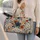 Blue And Rust Wildflowers for Weekend Getaways and Camping Trips for Women and Men Quilted Weekend Bag - 2