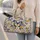 Blue and Golden Butterflies with Wildflowers for Weekend Travel and Garden Getaways Quilted Weekend Bag - 2