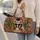 Black Cat Reading a Newspaper Among Cacti for Whimsical Everyday Escapes Quilted Weekend Bag - 2