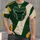 Green Gold Football Helmet Crest for Game Day Tailgates and Autumn Outdoor Wear All-over Print Unisex T-shirt - 4