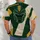 Green Gold Football Helmet Crest for Game Day Tailgates and Autumn Outdoor Wear All-over Print Unisex T-shirt - 6