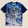 A realistic silver-white wolf in a snowy mountain forest beneath a turquoise and violet aurora. All-over Print Unisex T-shirt - 1
