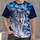 A realistic silver-white wolf in a snowy mountain forest beneath a turquoise and violet aurora. All-over Print Unisex T-shirt - 4