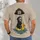 Grim Reaper Riding Rubber Duck in Rainy Day Humor for Alternative Casual Wear Fans All-over Print Unisex T-shirt - 4