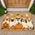 Five Costume-Wearing Dogs with Pumpkins for a Playful Halloween Home Seasonal Charm Doormat - 1