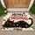 Playful Black Cat Tangled in Christmas Lights for Festive Holiday Cheer at Home Doormat - 1