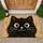 Big-Eyed Black Cat Face for Cozy Cat-Lover Homes and Playful Everyday Living Spaces Doormat - 1