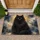 Glowing-Eyed Black Cat Portrait for Cozy Pet-Loving Homes, Feline Fans and Cat Lovers Doormat - 1