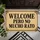 Spanish Welcome Saying with Ornate Black Flourishes for a Playful Entryway Home Doormat - 5