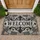 Vintage Welcome Plaque with Ornate Scrollwork for a Warm Traditional Home Entryway Doormat - 1