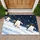 Three Penguin Snowfall Scene for Cozy Winter Entryway Living and Arctic Wildlife Fans Doormat - 1