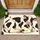Playful Black And Cream Cow With Spotted Coat For Cheerful Farmhouse Bathroom Style Doormat - 1