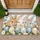 Three Easter Bunnies With Pastel Eggs for a Charming Springtime Entry Doormat - 1