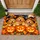 Golden Puppy Trio With Jack-O'-Lanterns for Cozy Halloween Home Decor Lovers Doormat - 1