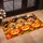 Golden Puppy Trio With Jack-O'-Lanterns for Cozy Halloween Home Decor Lovers Doormat - 2