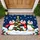 Three Scarf-Wearing Penguins Around a Snowy Tree for Cozy Christmas Holiday Cheer Indoors Doormat - 1