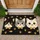 Three Bow-Tied Cat Faces With Tiny Fish Accents For Playful Cat-Loving Homes Everyday Doormat - 1