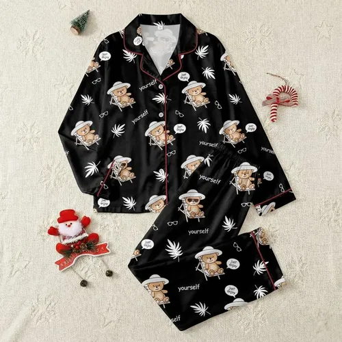Women's Whimsical Black Background Tan Teddy Bear Sunhat Lounge Chair Pattern with 'Just Enjoy Yourself' Text & Palm Fronds Satin Pajamas Set
