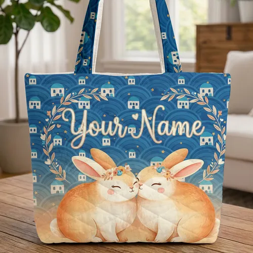 Two Bunnies Nuzzling Cycladic Houses Golden Stars Ocean Waves Sunset - Ocean Lover Gift Quilted Tote Bag