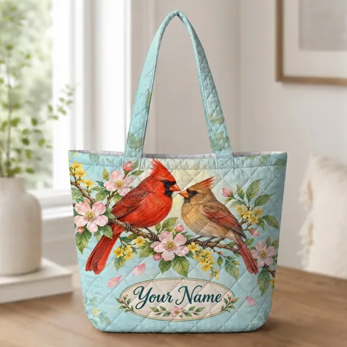 Colorful Cardinal Pair Among Spring Blossoms for Garden Lovers and Nature Enthusiasts Quilted Tote Bag